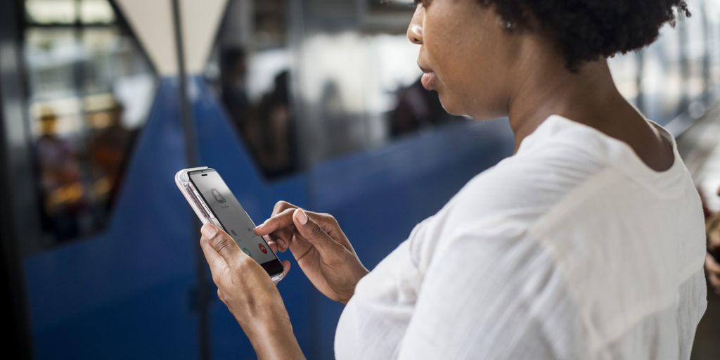 futuristic social media technology concept with diverse people using smartphones and digital devices